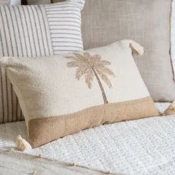 Coussin pompons palmier 50x30cm
